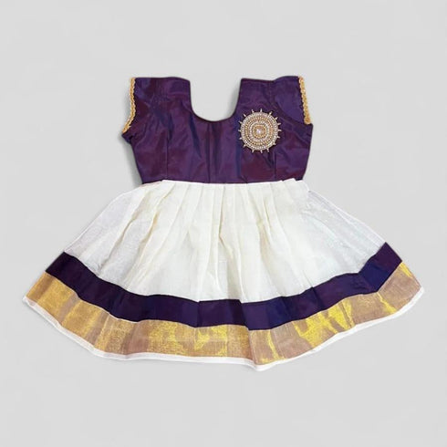 White and gold Kerala naming ceremony dress for girl child