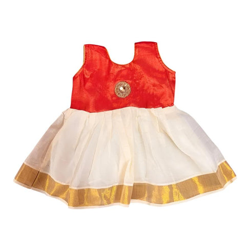 White and gold Kerala naming ceremony dress for girl child