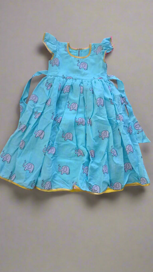 Girl wearing handmade block printed silk cotton frock in traditional Indian design (age 2-12 years)