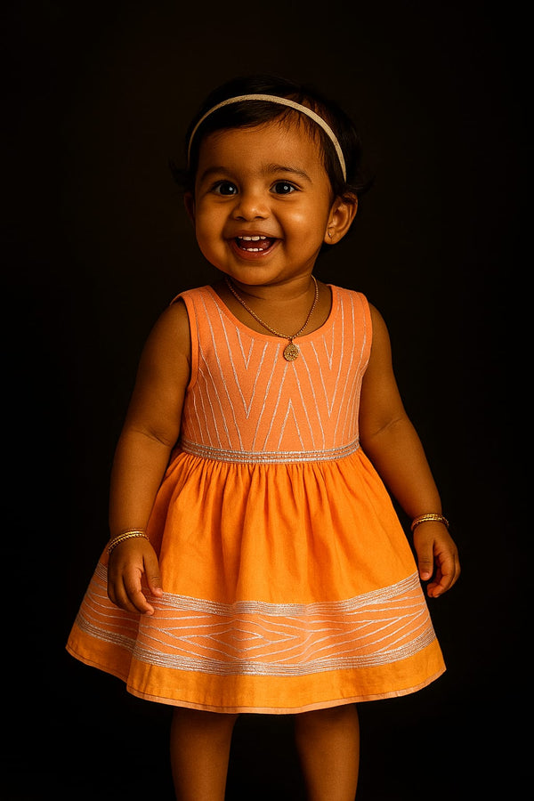 Girl wearing silk cotton festive dress with traditional Indian design